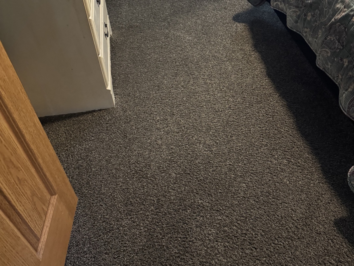 Finished gray bedroom carpet viewed from the doorway