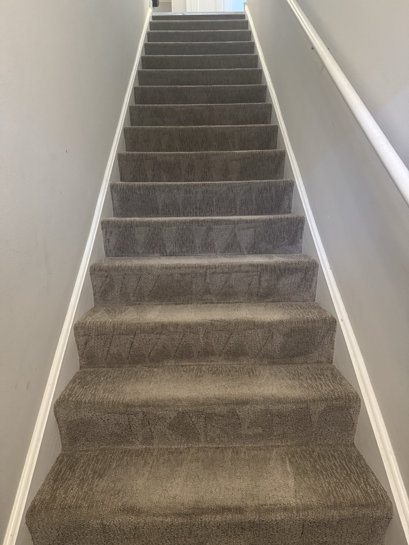 Full finished staircase viewed from the bottom after carpet cleaning